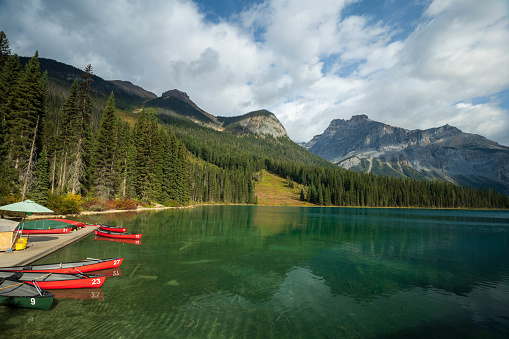 Canoeing on Emerald Lake in summer sunny day. Yoho National Park, Canadian Rockies