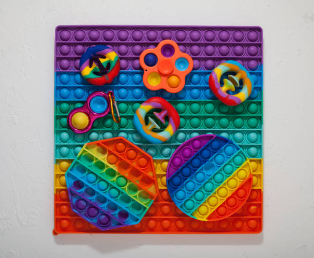 Popular colorful children's toys (Spinner, Simple dimple, Pop it and Snapperz toy)  Top view