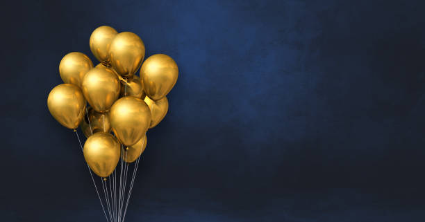 istock Gold balloons bunch on a black wall background. Horizontal banner. 1330565640