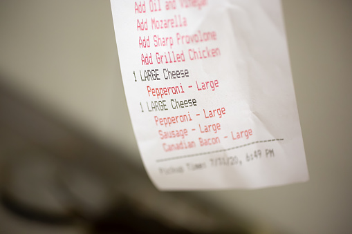 A closeup view of a restaurant order receipt.