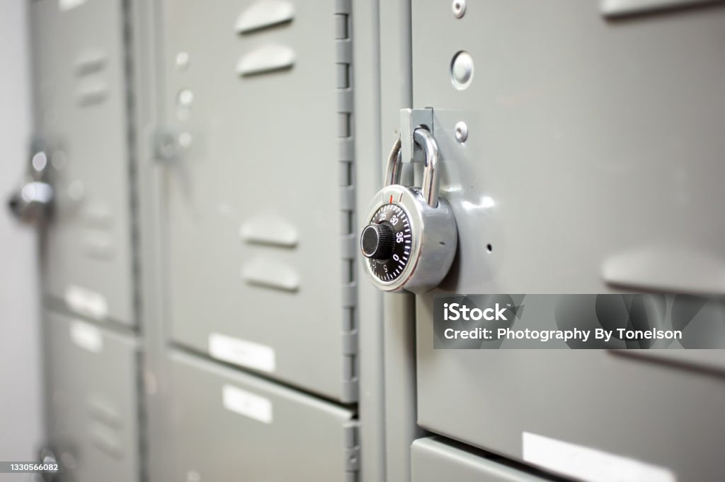 set of lockers A view of a set of lockers, featuring a combination dial padlock. Locker Stock Photo