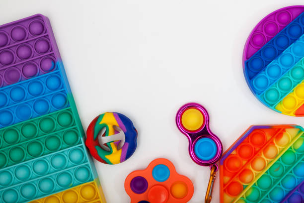 istock Trendy silicone toys (Snapperz, Pop it, Simple Dimple) on white background Selective focus, copy space 1330566318