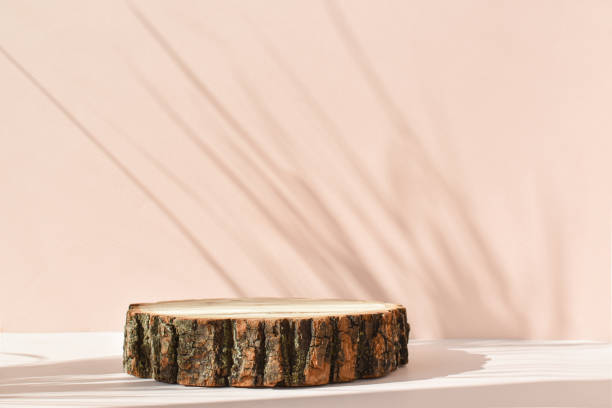 istock Wooden stage with shadows for presentation on a beige background. 1330571064