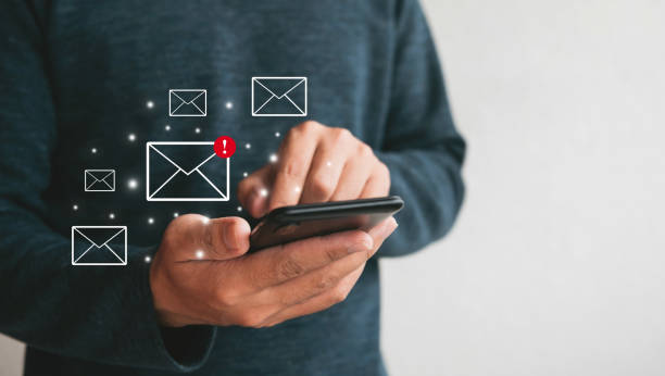 istock Close up hands holding smartphone. man using cellphone for marketing  and searching data and social media on internet.technology business investment concept 1330574416