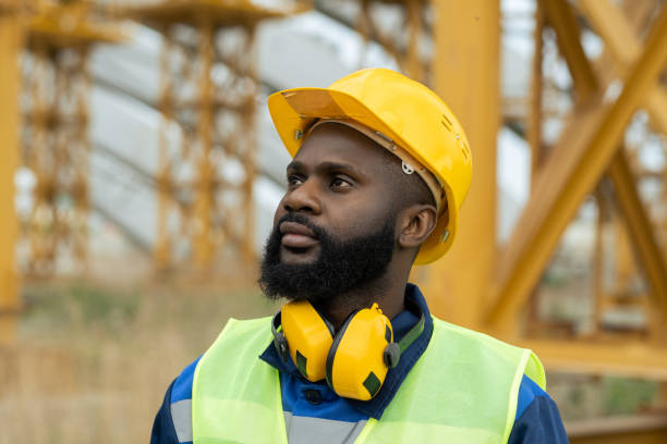 istock Builder in protective headphones outdoors 1330575915