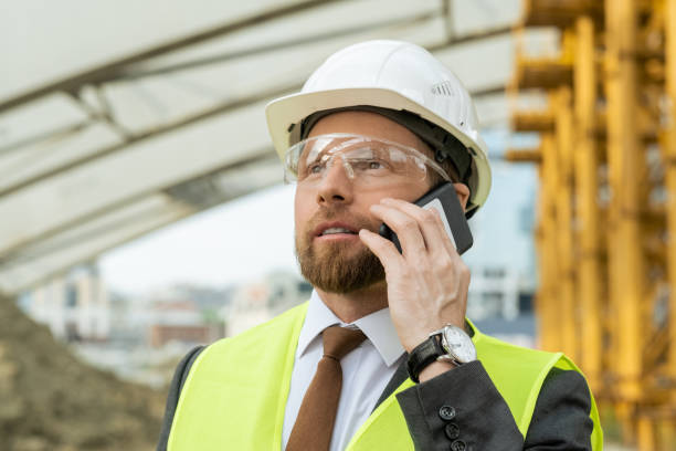 istock Engineer talking on the phone outdoors 1330575942