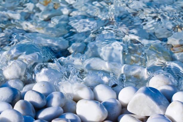 White and gray stones softly rounded and washed from fresh sea water.