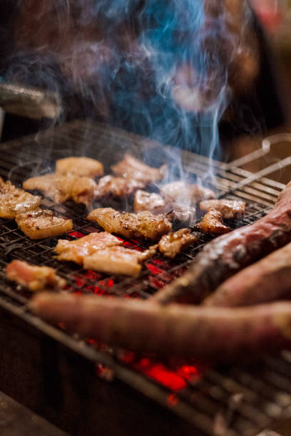 istock Family making barbecue in dinner party camping at night 1330578544