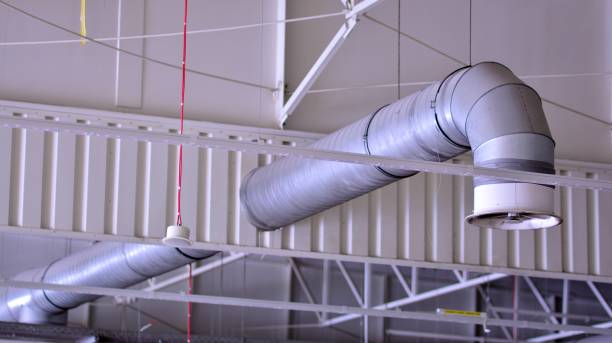 istock Lights and ventilation system on ceiling of the supermarket hall. 1330581709