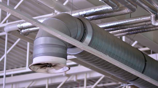 istock Lights and ventilation system on ceiling of the supermarket hall. 1330581765
