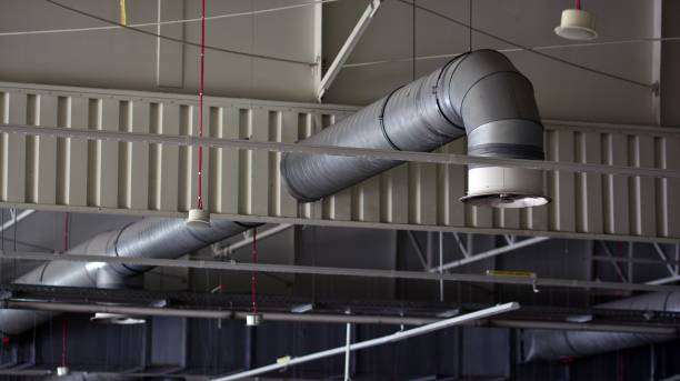 istock Lights and ventilation system on ceiling of the supermarket hall. 1330581784