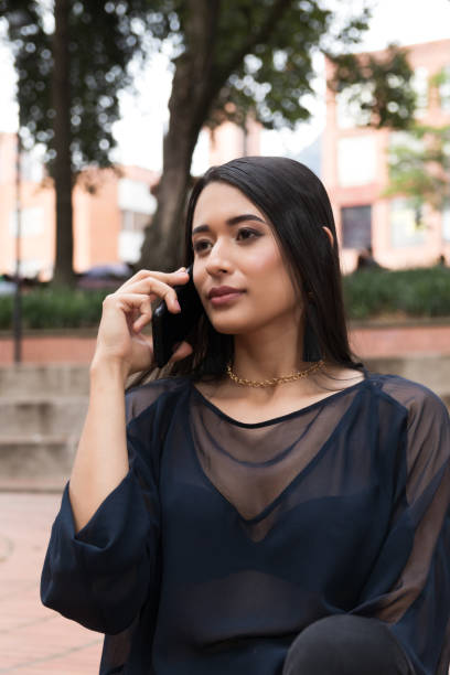 istock Latin lady talking on the cell phone 1330581918