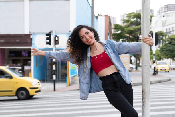istock latin woman walking through the city 1330582132