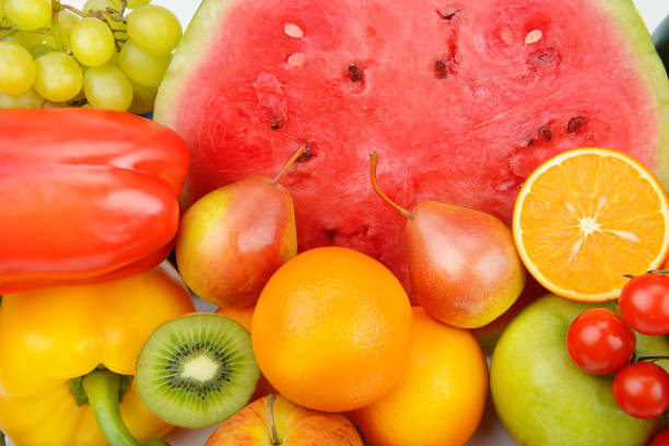 istock Beautiful bright background from various vegetables and fruits. 1330587594