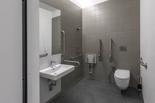 istock Public restroom for disabled handicapped people with special equipment 1330590196