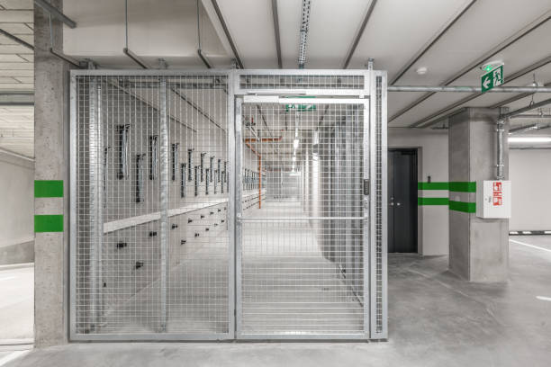 istock Empty public underground parking lot or garage interior with concrete stripe painted columns and signs 1330590198