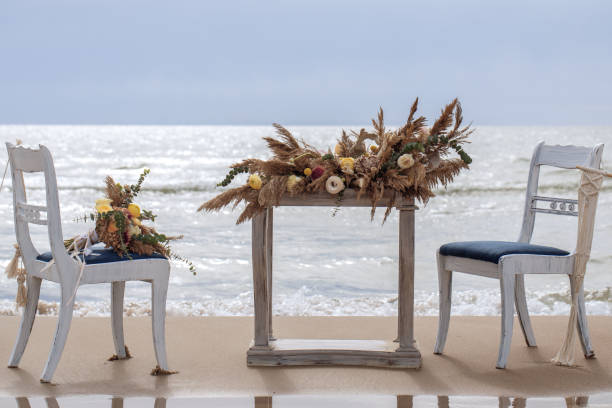 istock A table  designed for a boho style event with an eucalyptus, vintage plates and other rustic touches. On seaside in the sand dunes 1330590229