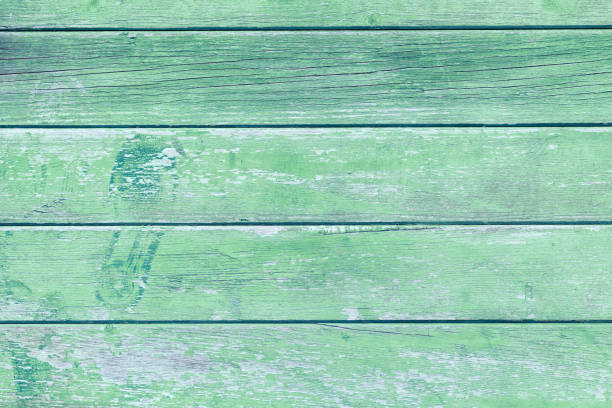 istock Wooden background with green colored planks 1330591976
