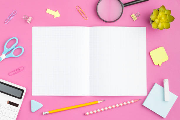 istock Spiral notepad with stationery on the desk 1330596284
