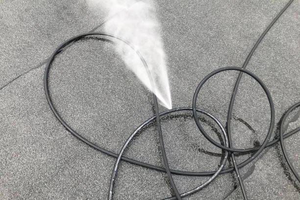 istock Punctured hose and high-pressure water leak 1330598302