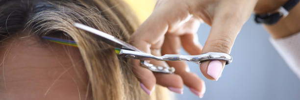 istock Sad woman at the barber cut bangs close-up 1330599528