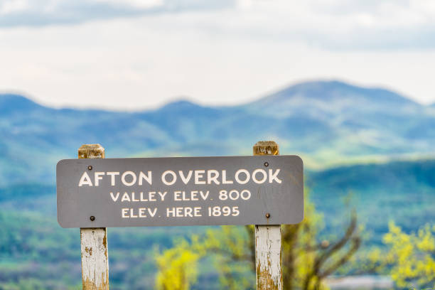 istock Overlook sign text for Afton valley and elevation at Blue Ridge parkway appalachian mountains in summer with nobody and scenic lush foliage bokeh background 1330601818