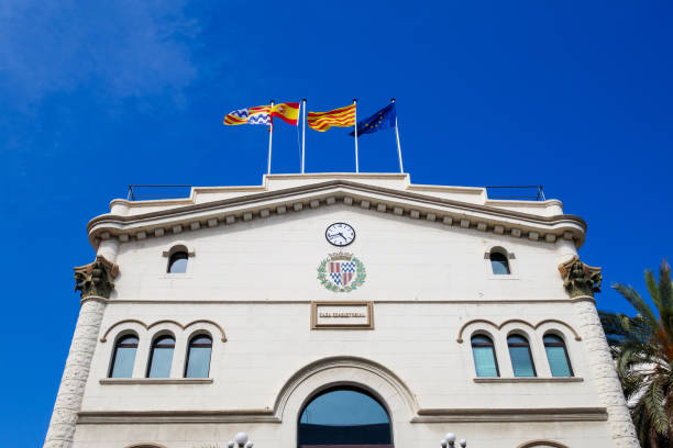 Casa Consistorial city hall in Badalona, Barcelona, Catalunya. Flags. Historicist stock photo
