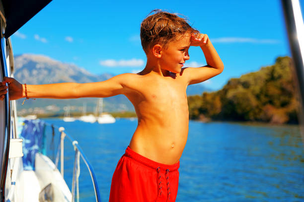 Kids having a good time on boat during summer vacation.