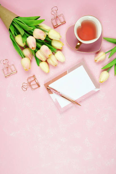 istock Feminine pink desktop workspace blog header overhead flat lay. 1330605082