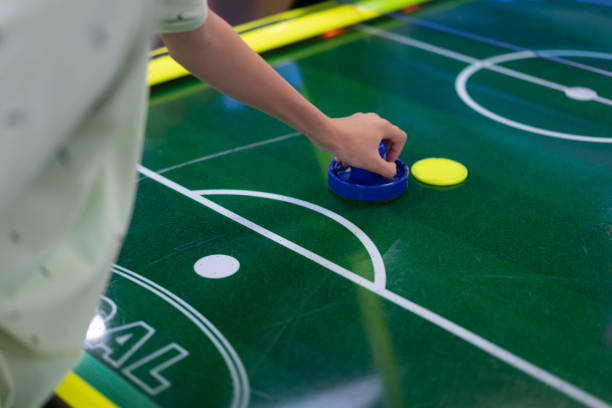 istock Boy hand playing air hockey 1330605903