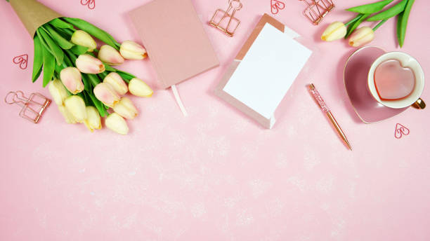 istock Feminine pink desktop workspace blog header overhead flat lay. 1330606024