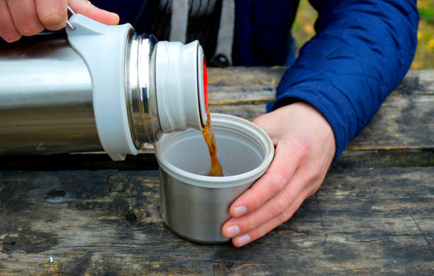 istock tea from a thermos in nature 1330606690