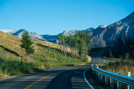 Road winding through Waterton Lakes National Park, Alberta, Canada