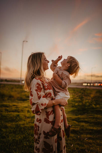 istock affection between mother and child at sunset 1330610850