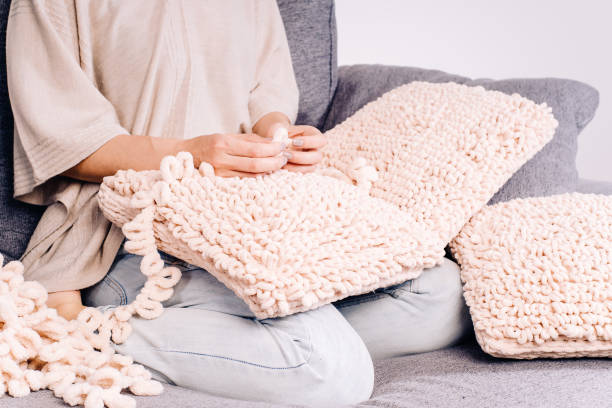 istock Knits made from thick soft yarn. Soft knitted cushions made of thick yarn. 1330615922