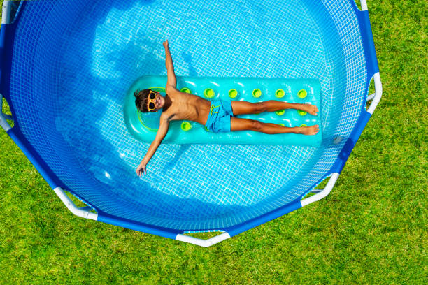 istock Boy swim on inflatable matrass view from above 1330615947