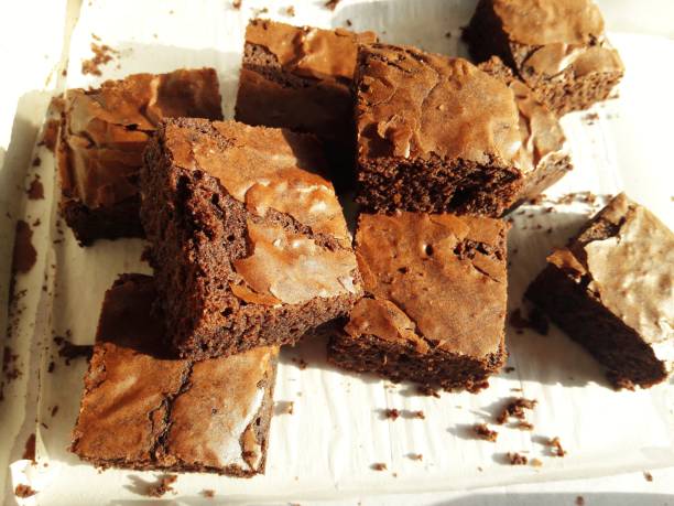 istock Pieces of chocolate brownie cake on the table 1330618764