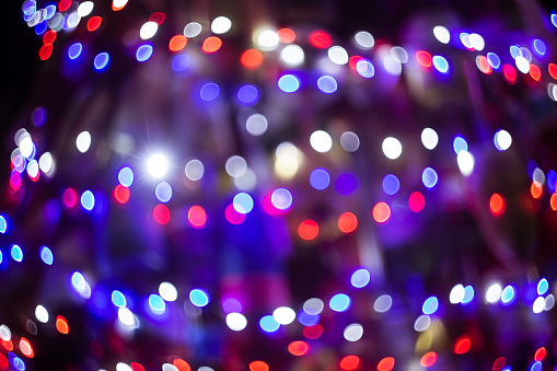Christmas lights on a tree in American flag colors: red, white and blue.