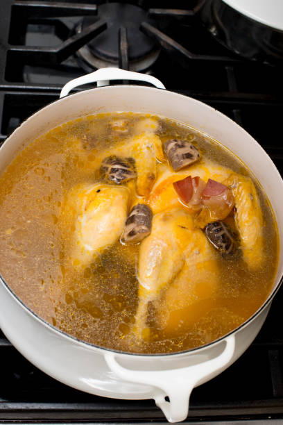 istock Asian style chicken soup in designer vintage Danish iron pot 1330622116