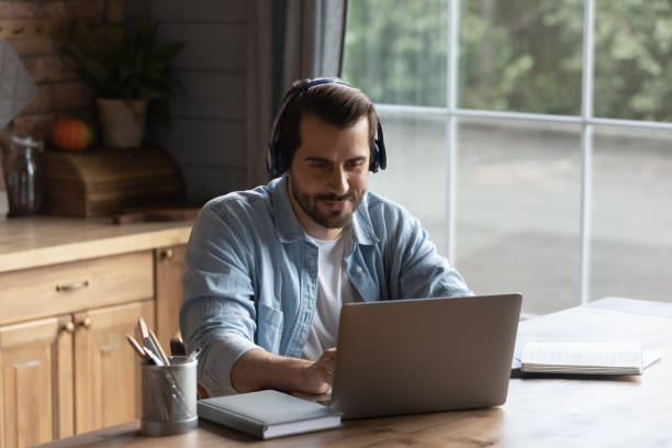 istock Happy adult student watching learning webinar, making video call 1330622999