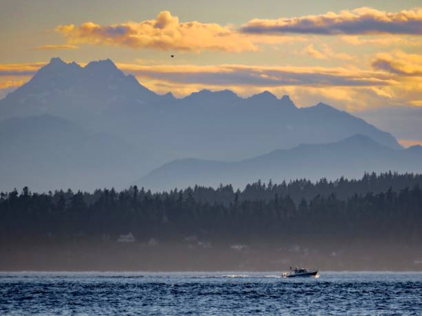 istock Boat and the Olympic Mountains at Sunset 1330624514