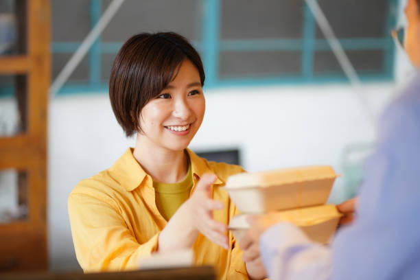 Women buying meals on the move