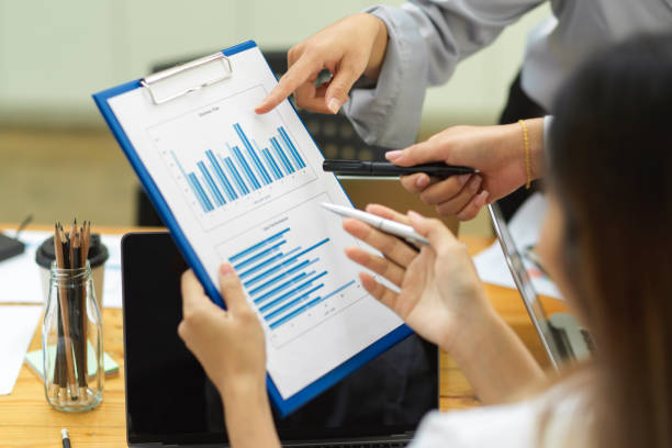 istock Business team looking and discussing on report papers 1330633202