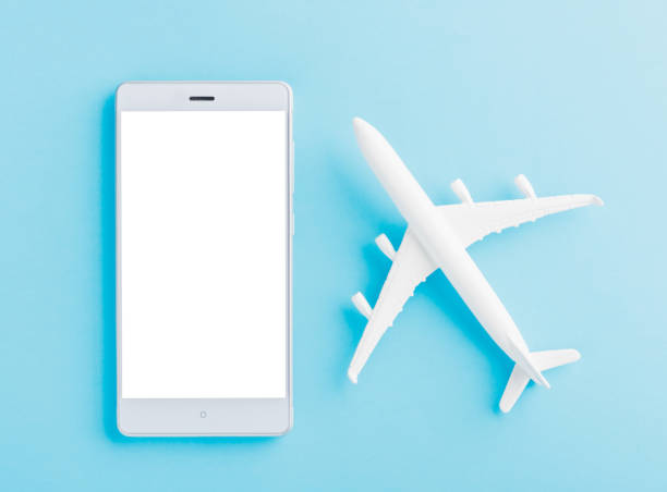 istock minimal toy model plane, airplane, and smartphone blank screen 1330634524