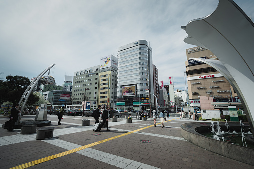 OSAKA, JAPAN - MAR 2015 : Japanese people walking street in the city. Cinematic color tone filter.