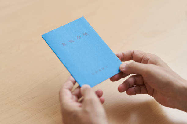 istock Hands of elderly people with a pension book 1330639741