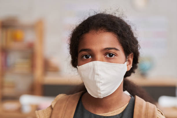 istock Girl Wearing Mask 1330639855