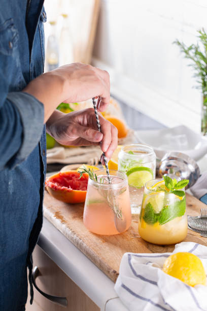 istock Mixologist making refreshing cocktails with hard seltzer at home 1330639973
