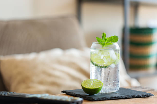 Hard seltzer cocktail with lime for relaxing afternoon at home stock photo