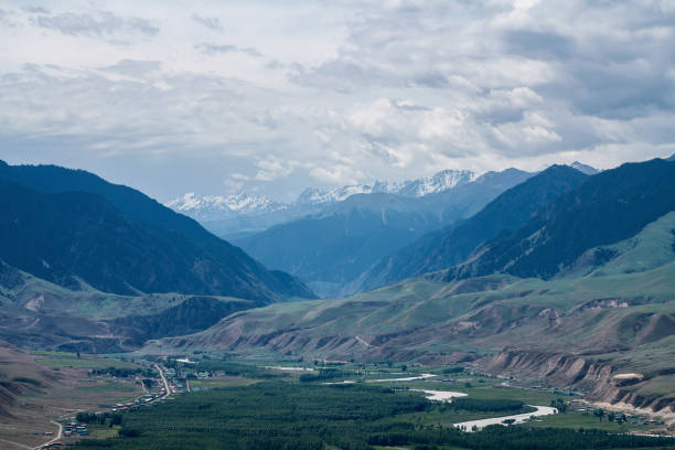 istock Grassland and mountains in a sunny day. 1330641156